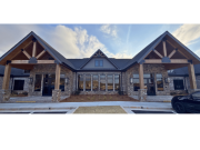 Symmetrical office building with covered entry and large windows