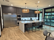 Break room with glass garage doors opening to covered patio